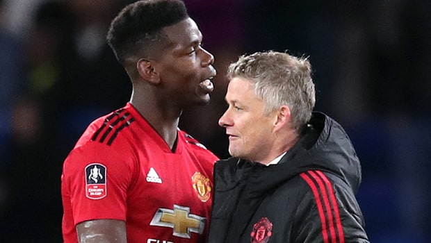 Ole-Gunnar-Solskjaer-and-Paul-Pogba-Man-United-min