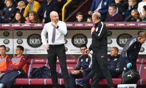 Burnley manager Sean Dyche speaks with the fourth official during the Premier League match