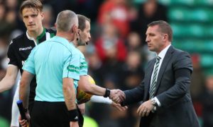 Celtic manager Brendan Rodgers shakes hands with referee William Collum